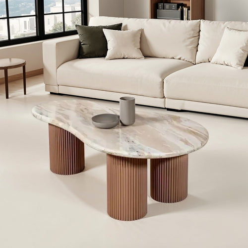Ashford pedestal coffee table with a natural white marble top and pale taupe fluted solid mango wood legs.
